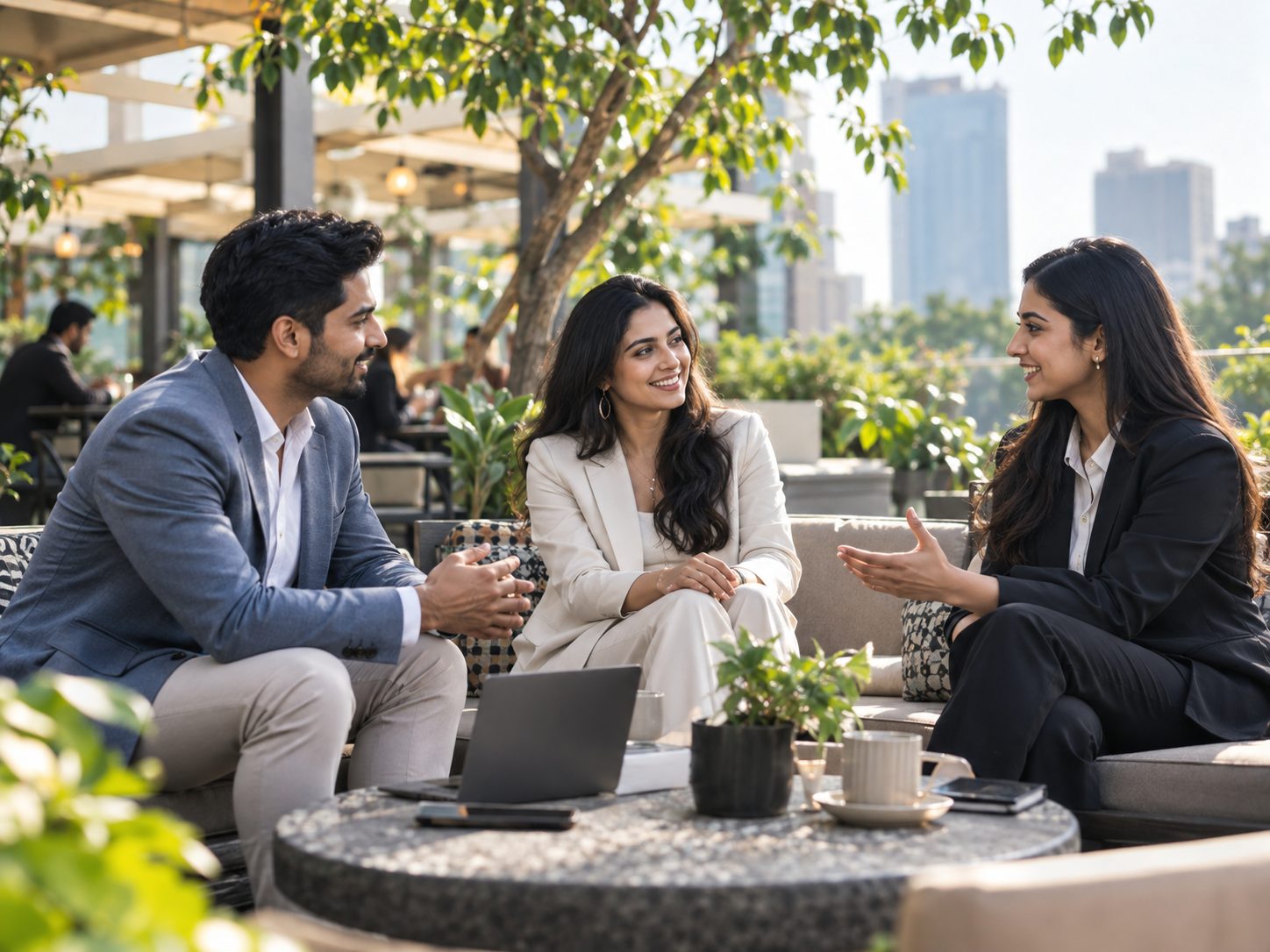 HR team in conversation on a rooftop terrace
